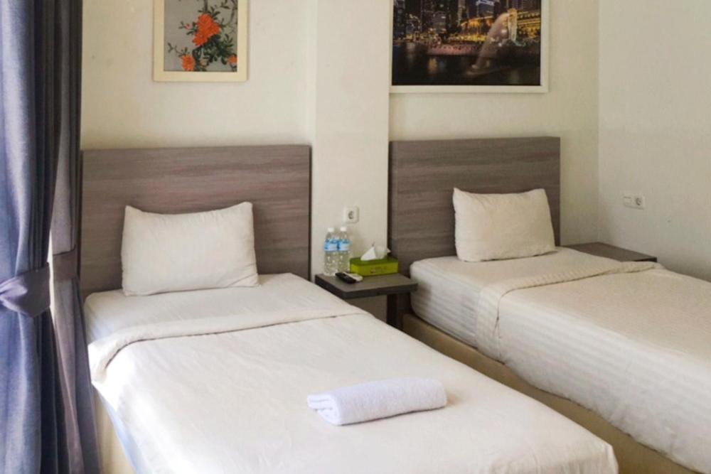 Twospaces Living At Maximus Inn Palembang Buitenkant foto